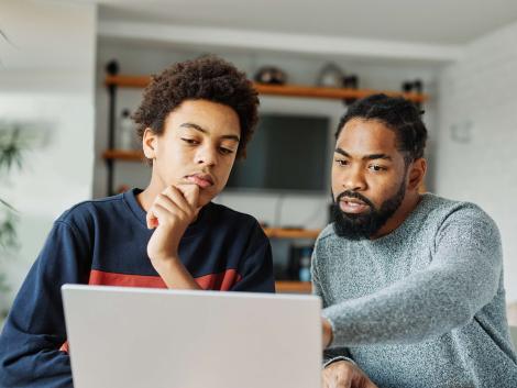 Student and parent looking at computer