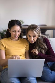 Student and mother looking at a computer