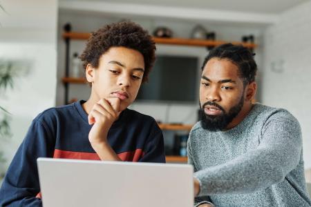 Student and parent looking at computer