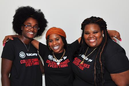 3 ISACorps staff members smiling and posing for a picture