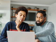 Student and parent looking at computer