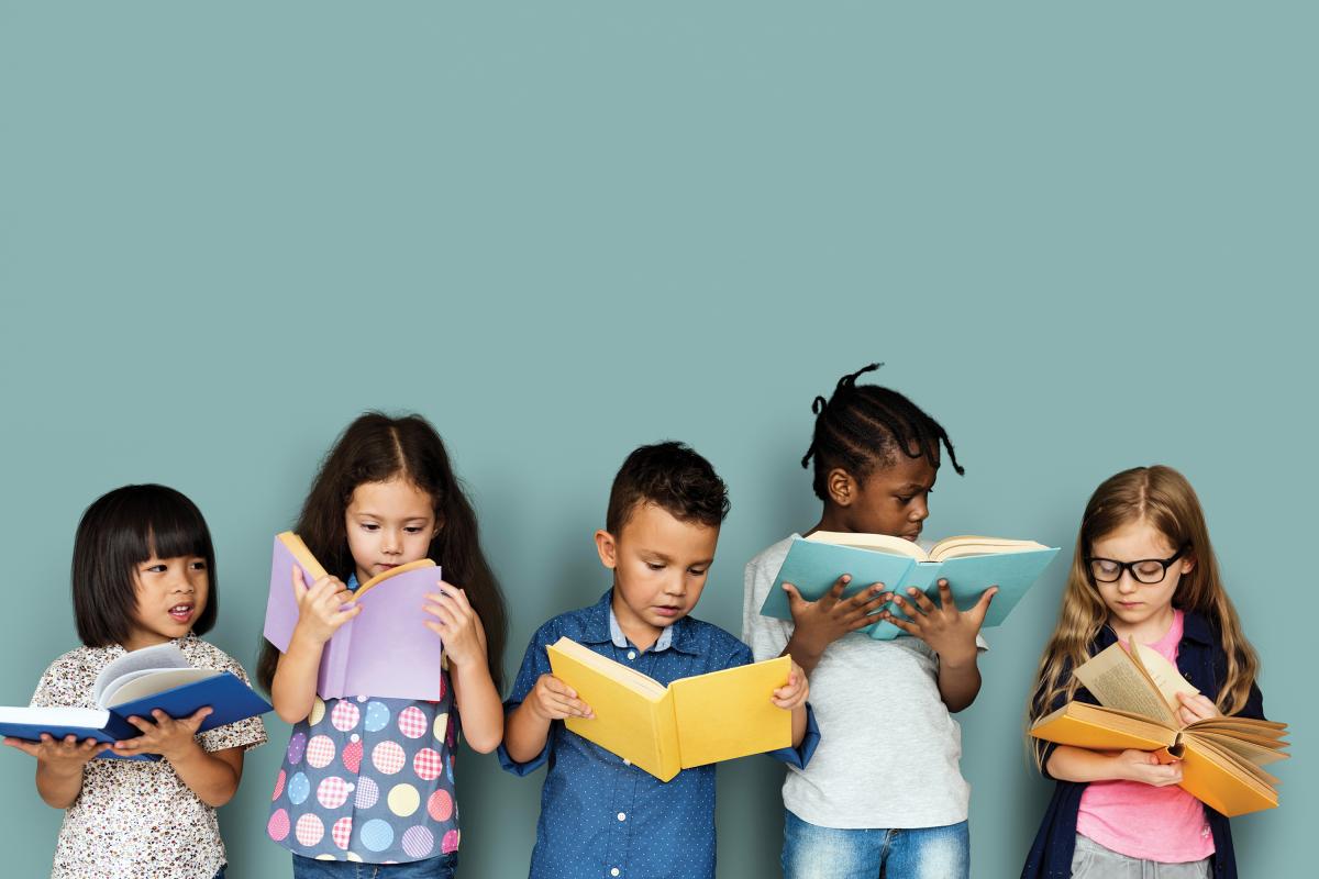 Diverse children enjoying reading books