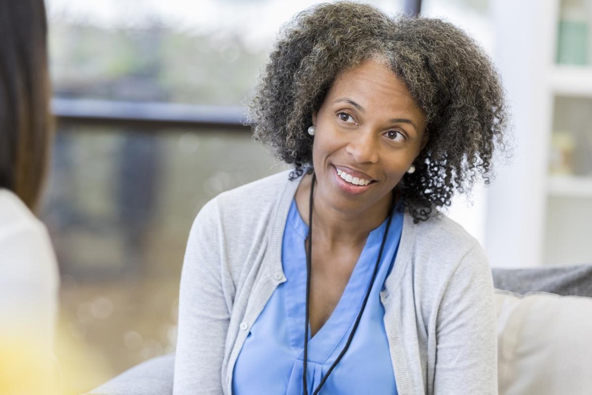Behavioral Health Care Professional talking to one woman