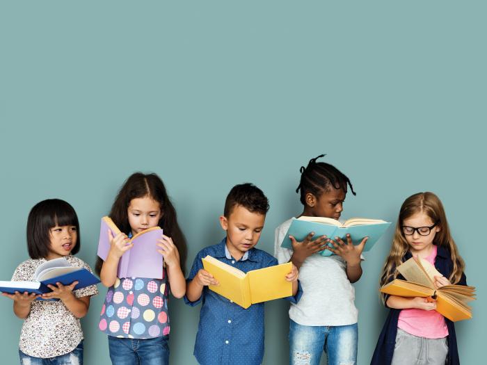 Diverse children enjoying reading books